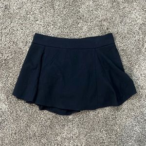 super dark navy blue almost black mini brandy melville skirt with shorts inside